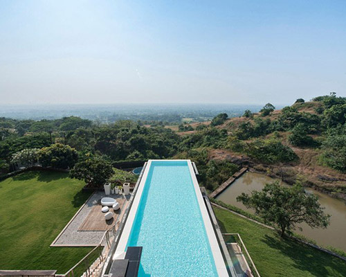 shroffleon designs rooftop infinity pool with uninterrupted views of mumbai's landscape
