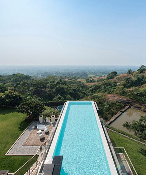 shroffleon designs rooftop infinity pool with uninterrupted views of mumbai's landscape