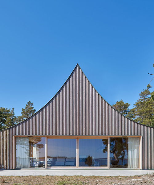 tham & videgård builds 'tent-like' vacation home on an island near stockholm