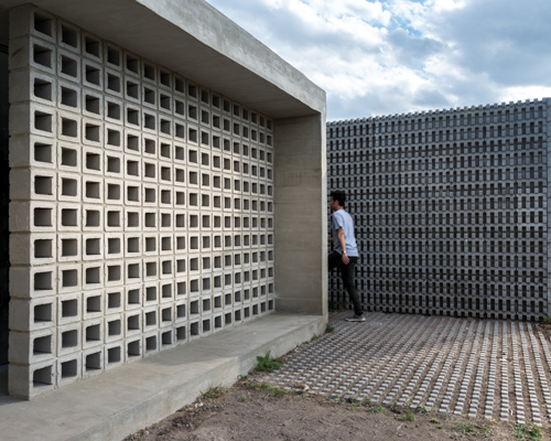 agustin lozada blends concrete and glass for pair of low-cost housing units in argentina