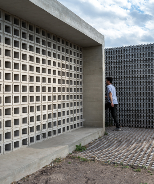 agustin lozada blends concrete and glass for pair of low-cost housing units in argentina