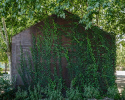 beta.0's madrid tennis school buildings are designed to disappear into the landscape