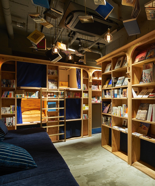 book and bed hotel welcomes guest to sleep among the bookshelves after a bedtime story