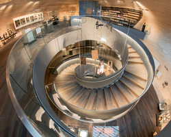 coop himmelb(l)au's spiraling 'house of bread' is conceived as a cabinet of curiosities