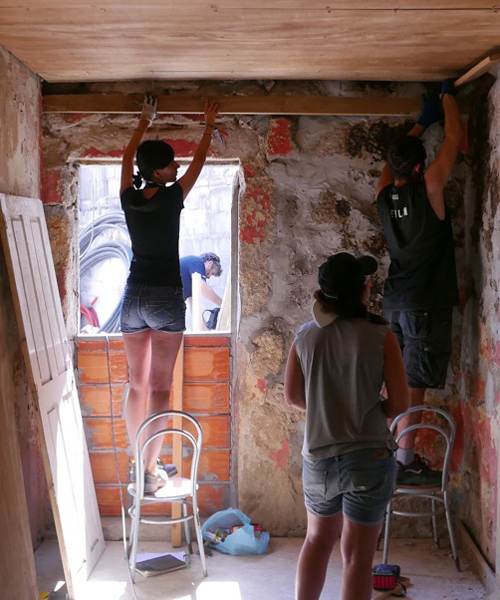 students of the critical concrete summer school refurbish run-down houses in porto