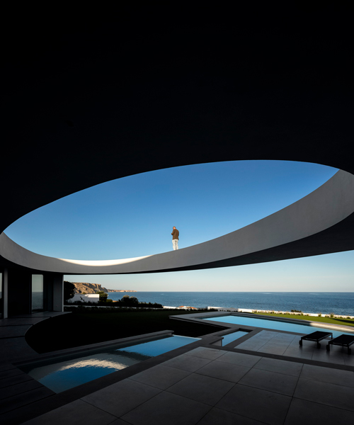 mário martins atelier's elliptical seaside residence balances contrasting geometries