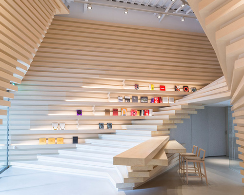 kengo kuma creates stacked wooden façade for whitestone gallery in taipei