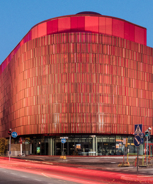 lahdelma & mahlamäki clads helsinki shopping center with undulating façade of ceramic tiles