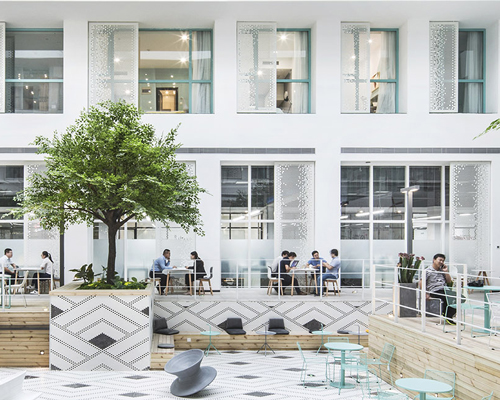 MAT office's beijing apartment complex and co-working space features a 16 meter-high atrium