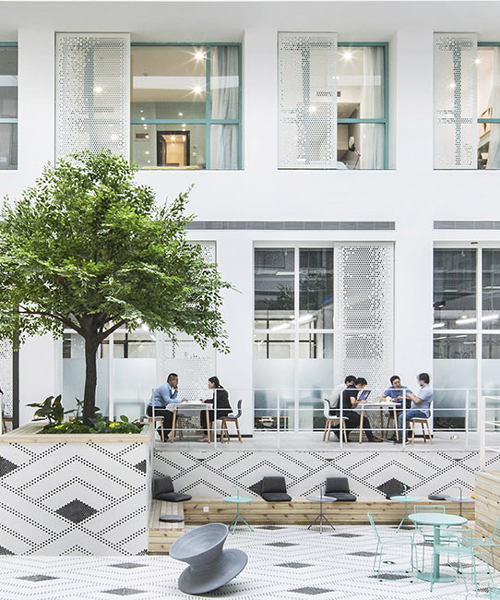 MAT office's beijing apartment complex and co-working space features a 16 meter-high atrium
