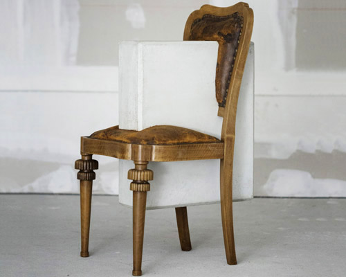 studio nucleo melds dramatic concrete blocks with antique furniture