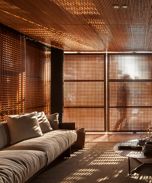 mf+arquitetos' wooden screens + garden walls establish harmony in collector's residence