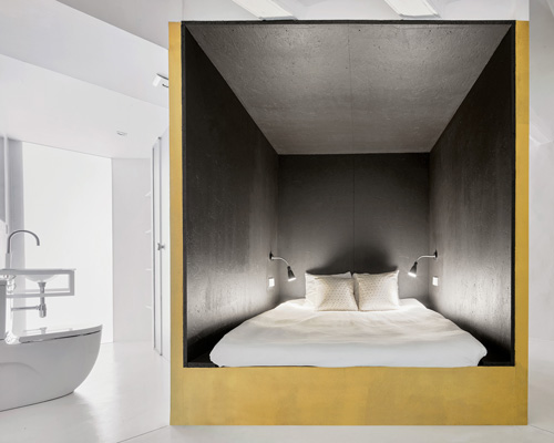 raul sanchez stacks colorful volumes inside the 'duplex tibbaut' in barcelona