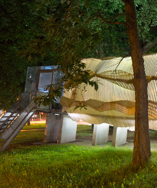 architecture students wrap bernard tschumi's glass pavillion in wooden shell