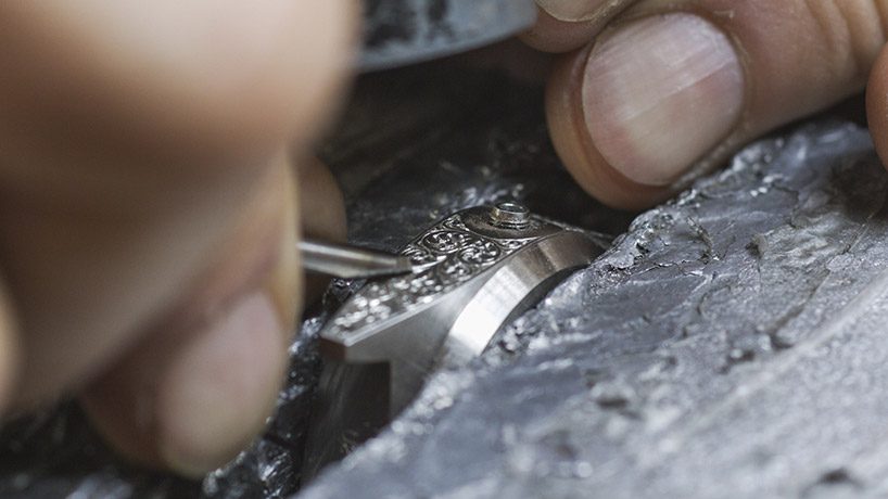 unimatic employs master decorator of guns to create unique timepieces