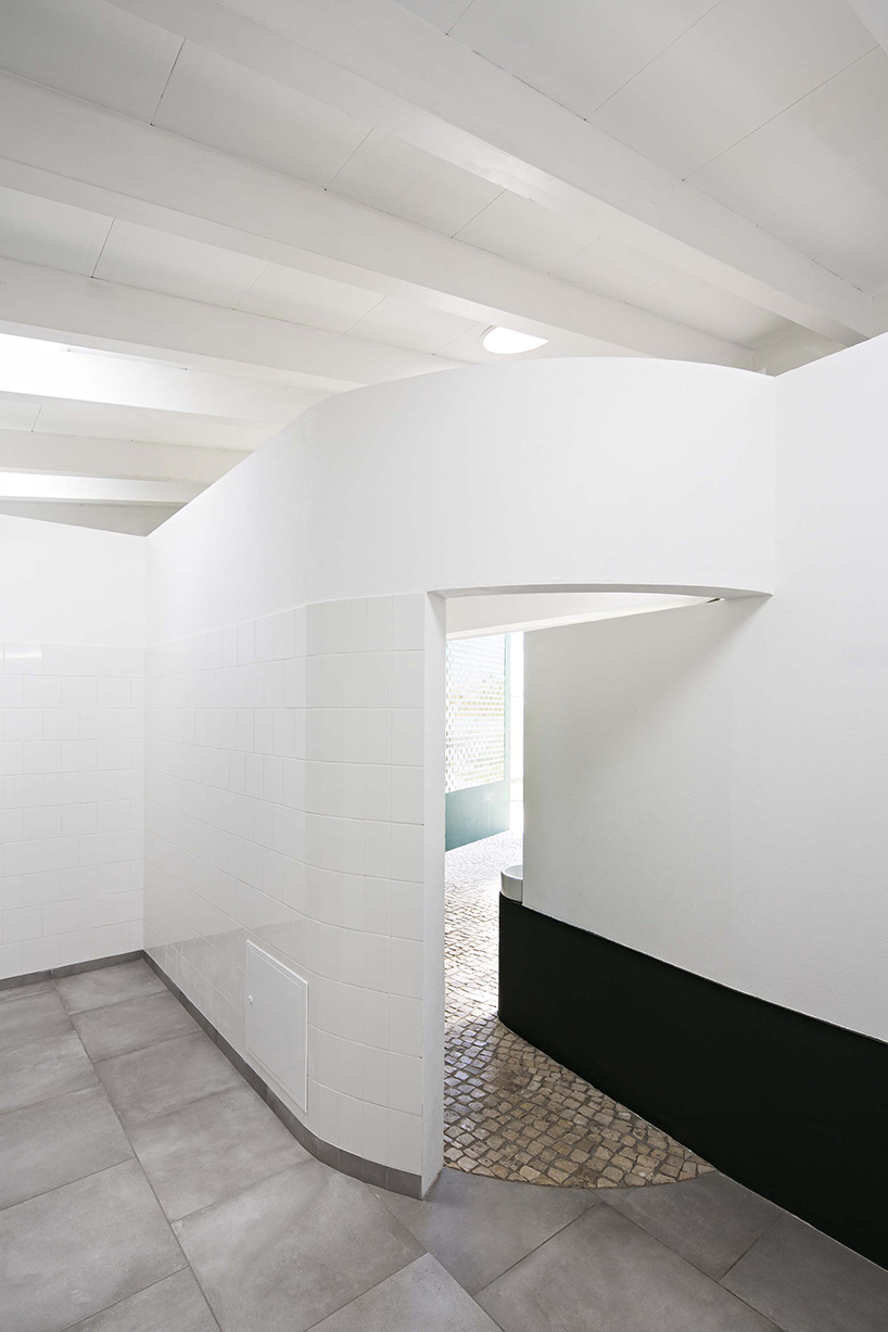 m2.senos camouflages geometric and abstract restrooms for a cemetery in portugal