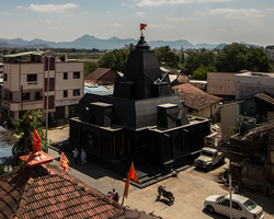 within n without sites all-black stone temple at the heart of a village in india