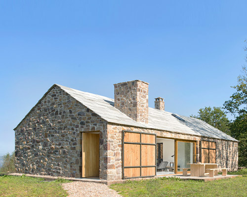 laura alvarez architecture transforms stone shed into a rustic holiday retreat in cantabria