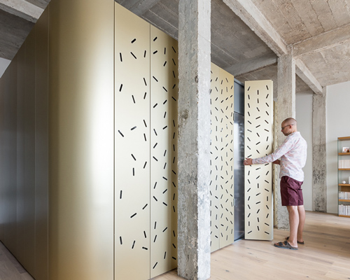SABO project drops an aluminum island in a raw parisian loft
