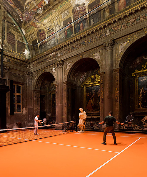 asad raza installs neon orange, interactive tennis court inside 16th century church in milan