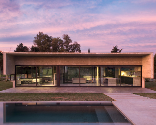 luciano kruk's concrete dwelling in argentina maintains airy, open feel