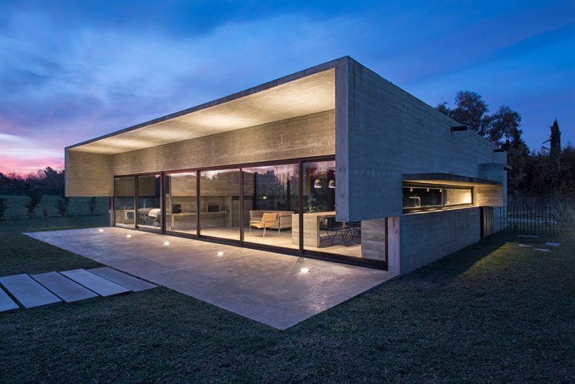 luciano kruk's concrete dwelling maintains open feel despite the material