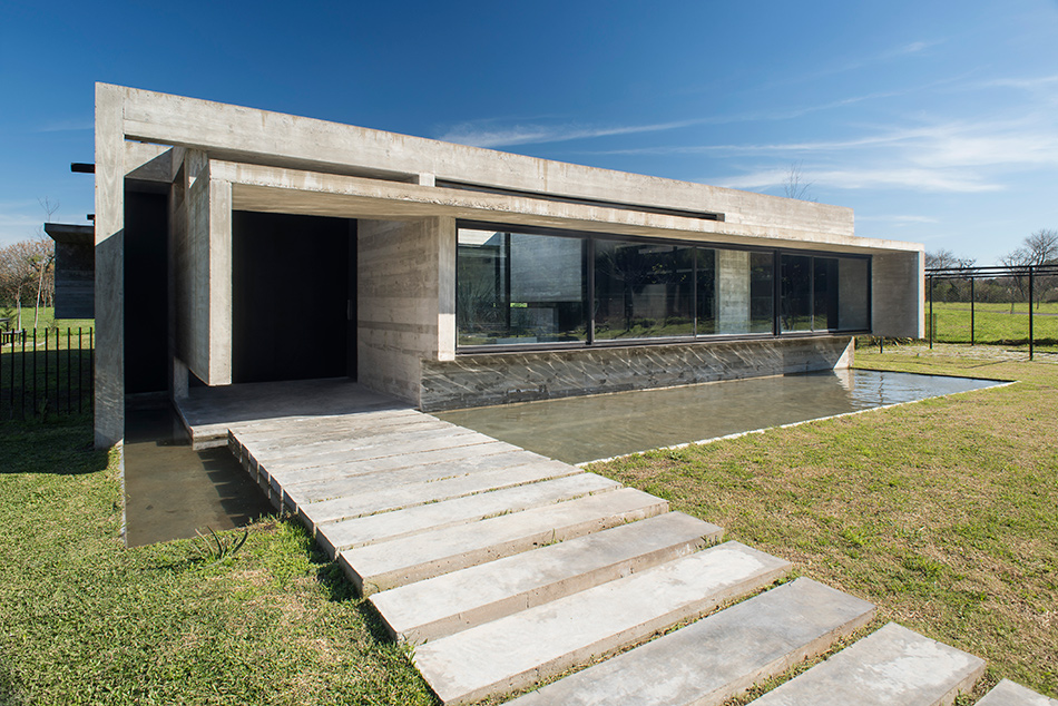 luciano kruk's concrete dwelling in argentina maintains airy, open feel