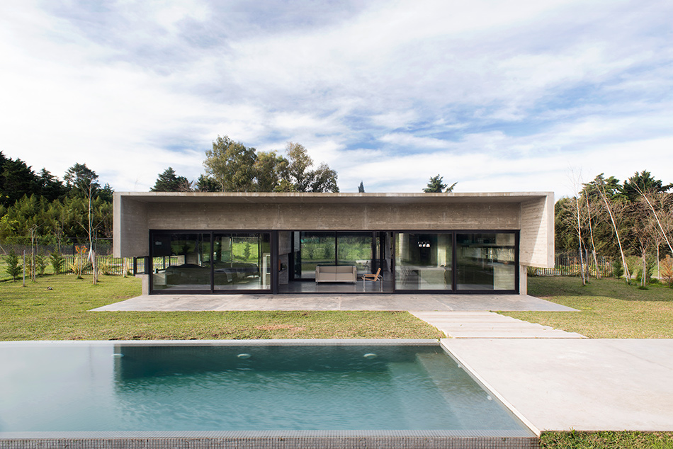 luciano kruk's concrete dwelling in argentina maintains airy, open feel