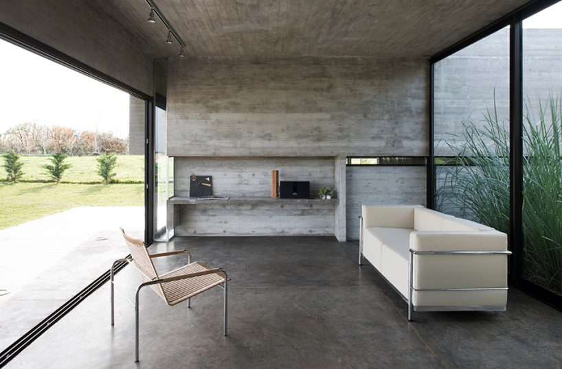 luciano kruk's concrete dwelling maintains open feel despite the material