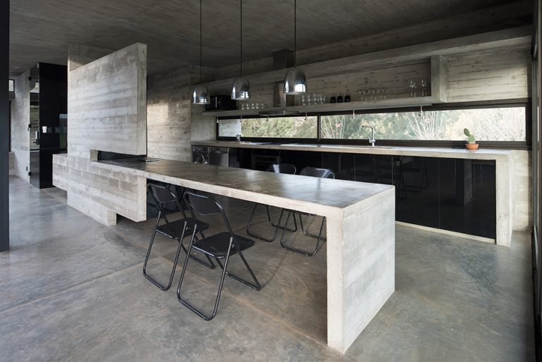 luciano kruk's concrete dwelling maintains open feel despite the material