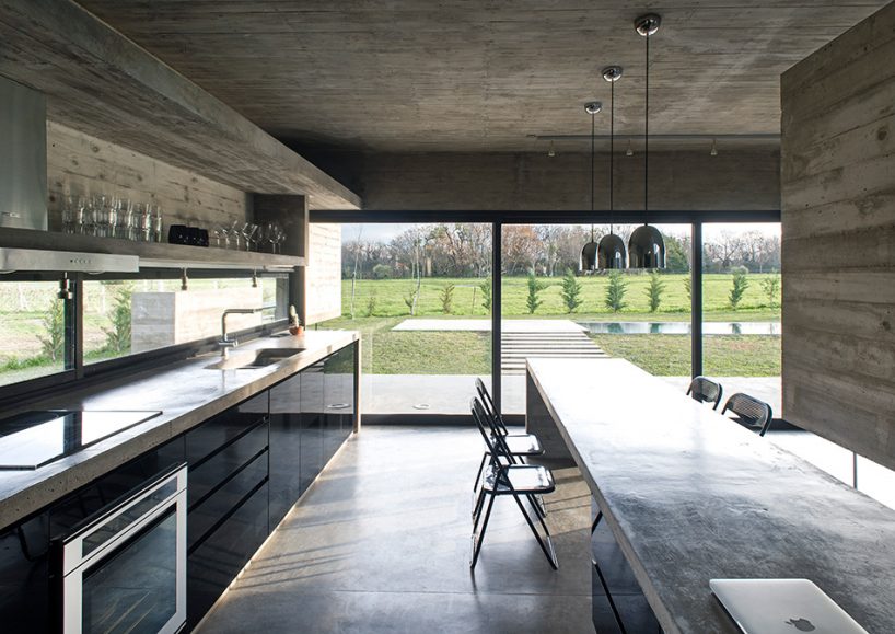 luciano kruk's concrete dwelling maintains open feel despite the material