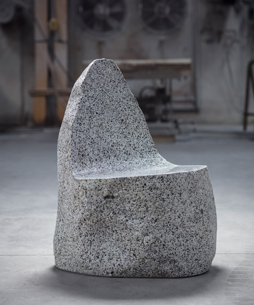 max lamb sculpts stone 'boulder' seats using granite sourced from northern italy