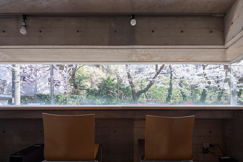 oriel window house by shinsuke fujii offers views of the neighboring cherry blossoms