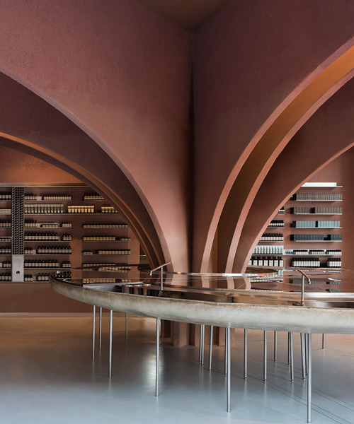 snøhetta uses red plaster-clad arches to delineate aesop store in london