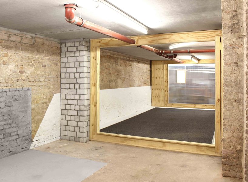 the kardamov studio in berlin is conceived within an empty basement by so + so studio