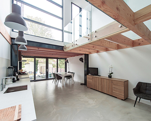 bloot refurbishes row house in the netherlands with a warm atmosphere and open spaces