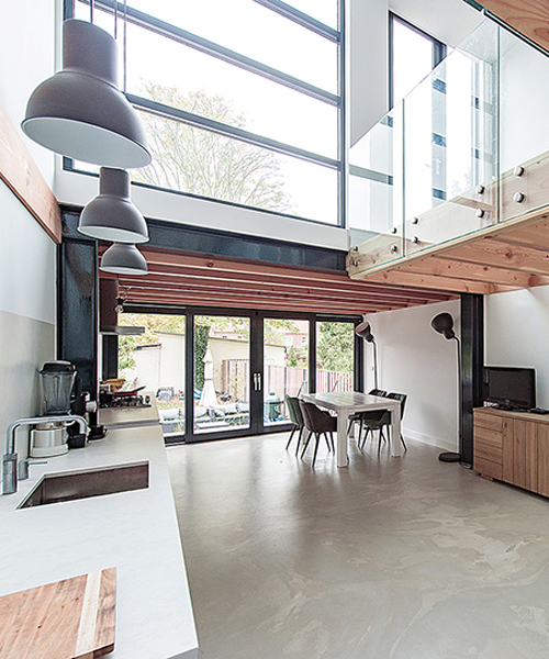 bloot refurbishes row house in the netherlands with a warm atmosphere and open spaces