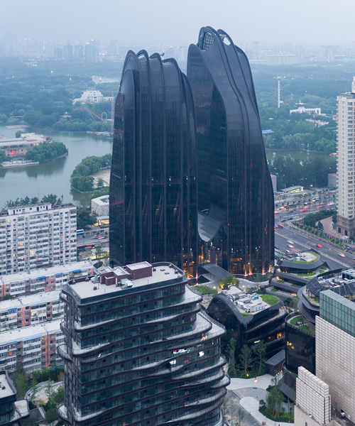 iwan baan photographs the fluid forms of MAD architects' chaoyang park plaza in beijing