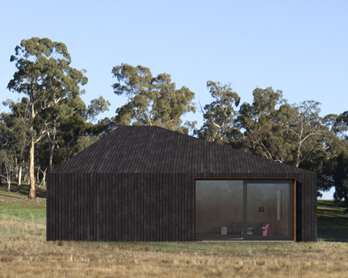 adam kane architects designs asymmetrical timber cabin in rural victoria