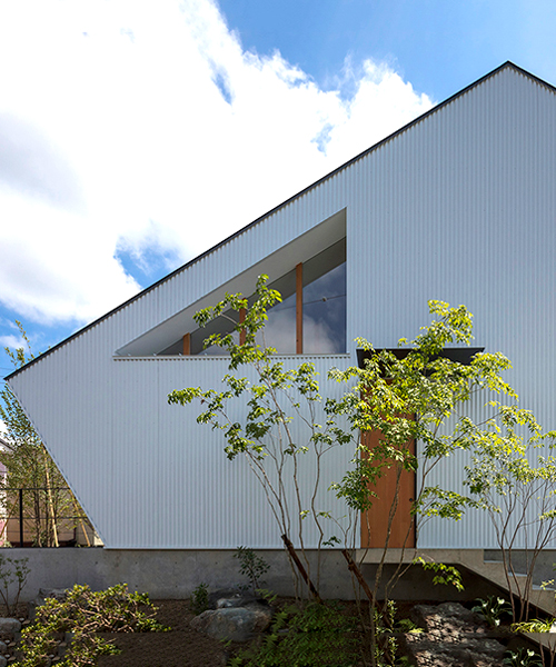 arbol design incorporates angular gabled roof in quaint japanese home