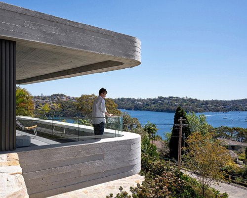 luigi rosselli designs 'books house' as series of stacked concrete slabs