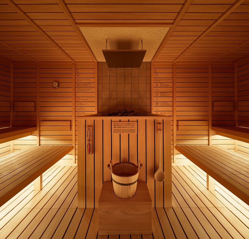 schemata architects ℃ capsule hotel combines micro-living with a unique sauna experience