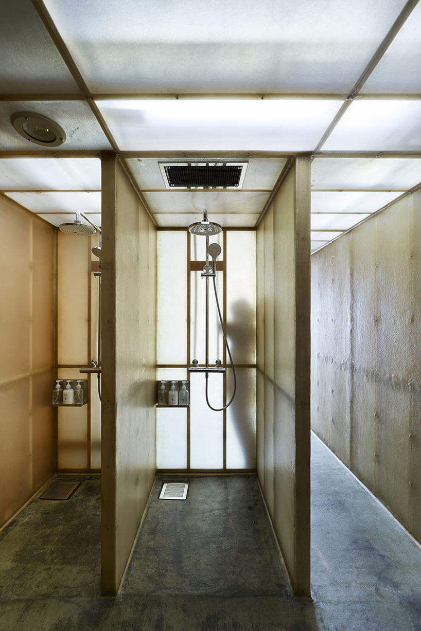 schemata architects ℃ capsule hotel combines micro-living with a unique sauna experience
