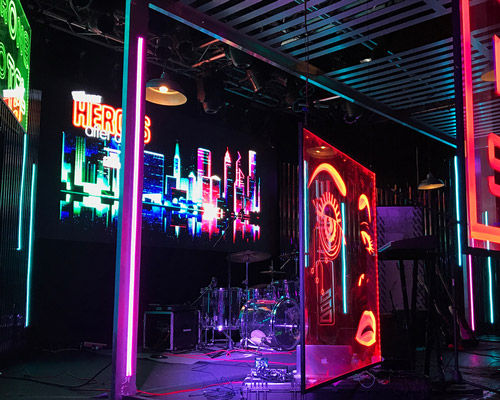 clickspring design creates a futuristic neon-noir venue for comic con's kickoff party