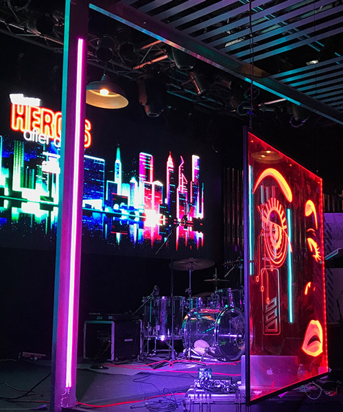 clickspring design creates a futuristic neon-noir venue for comic con's kickoff party
