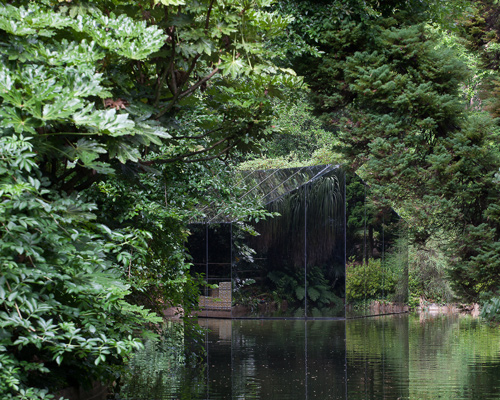 depA hides reflective pavilion within the grounds of porto's serralves foundation