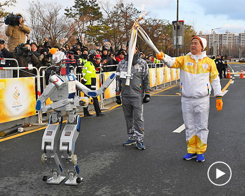 humanoid robots carry the torch ahead of south korea winter olympics 2018