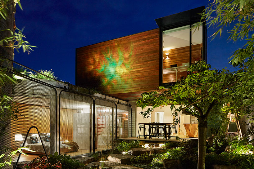 austin maynard transforms 'kiah house' into a serene home-office covered by plants