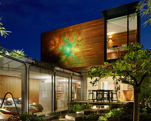 austin maynard transforms 'kiah house' into a serene home-office covered by plants