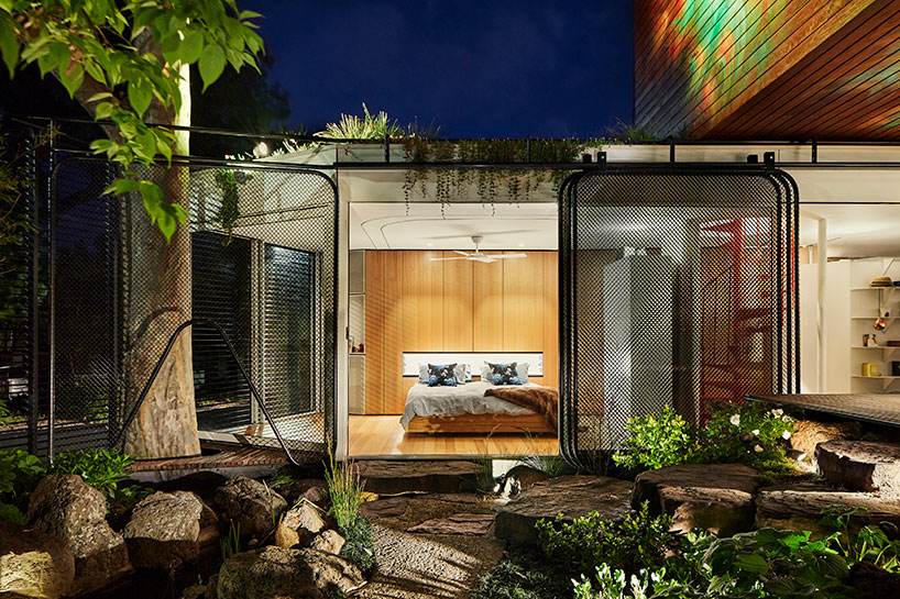 austin maynard transforms 'kiah house' into a serene home-office covered by plants